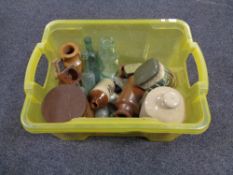 A box containing antique and later glass bottle, stoneware, bottles, tins etc.