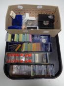 A tray containing a large quantity of foreign coins, pre decimal coinage, pound coins,