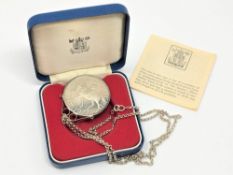 A Silver Jubilee crown mounted in silver as a pendant on a sterling silver chain.