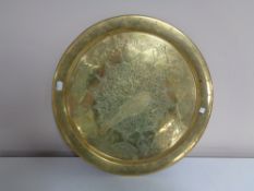 A circular brass Eastern plaque.