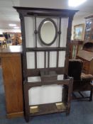 An oak Arts and Crafts hall stand.