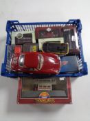 A crate containing diecast vehicles including Corgi tramlines, Burago vehicle, etc.