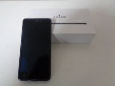 A Kazam Tornado 348 mobile phone with headphones