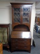 An oak Arts and Crafts leaded glass door bureau bookcase.