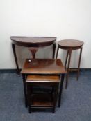 A nest of three oak tables together with a D shaped hall table and an oval occasional table.