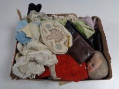 A box containing a beaded handbag, a cloth doll, leather wallet, dolls clothes etc.