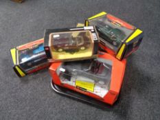 Five boxed Burago 1/24 1/25 1/18 scale die cast vehicles to include BMW, Range Rover, Jaguar, etc.