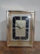 A Bulova quartz mantel clock.