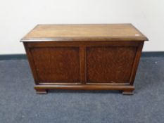 A 20th century narrow oak blanket box.