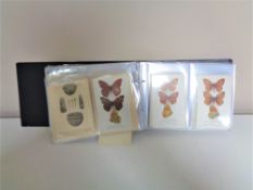 An album containing antique and later postcards to include British Museum,