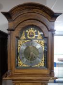 A continental scumbled-cased longcase clock, dial signed Hans Nielson, with pendulum and weights.