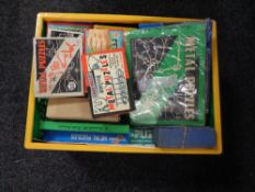 A basket containing vintage and later metal puzzles.