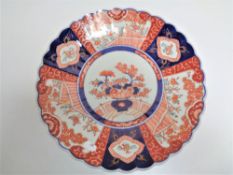 A 19th century Japanese Imari scalloped edged plate.