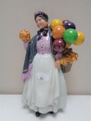 A Royal Doulton figure, Biddy Penny Farthing, HN1843.