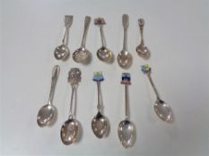 Ten silver crested teaspoons.