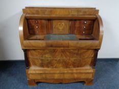A late 19th century mahogany Empire style cylinder bureau.