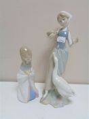 Two Lladro figures, Girl feeding ducks and Girl kneeling.