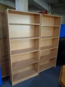 A pair of pine effect office open bookshelves.