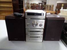 A Technics four piece midi Hi-Fi separates system with speakers and remote.