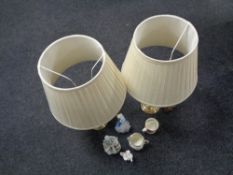 A tray containing a pair of brass table lamps with shades, a Lladro figure,