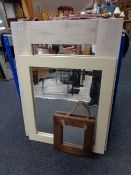 Three contemporary framed mirrors.