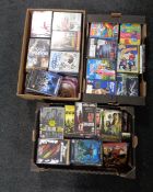 Three boxes containing assorted DVDs.