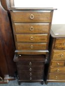 A pair of Stag Minstrel four drawer bedside chests.
