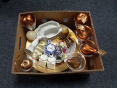 A box containing contemporary wine glasses, glass fruit bow with artificial fruit,