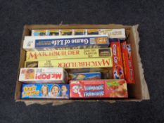 A box containing vintage games to include Tomy, Screwball, Scramble, Game of Life,