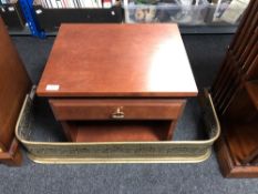 An antique brass fire curb together with a contemporary bedside table fitted to drawer.