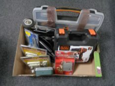 A box containing cased Black and Decker drill, Black and Decker jigsaw, nail door locks,