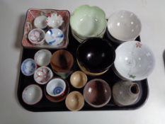 A tray containing oriental china and pottery, finger bowls, rice bowls, vases etc.