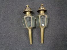 A pair of early 20th century brass Coach lamps with etched glass panels.
