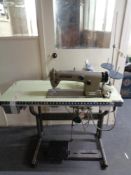 A Brother industrial sewing machine in table.