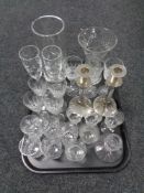 A tray containing assorted glassware to include silver plated glass stemmed candlesticks, vases,