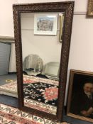 A 5' x 2' bronzed mirror