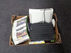 A box containing X-Box 360 console with leads, controller, accessories and games.