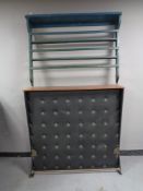 A mid century teak topped cocktail bar together with a painted Delft rack