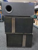 A pair of Bose speakers together with a Jamo SW140 speaker.