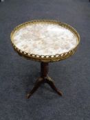 A French style mahogany marble topped wine table with brass gallery and mounts.