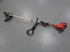 An Homelite petrol garden strimmer