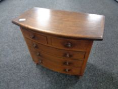 A miniature Victorian style apprentice piece five drawer chest, height 31 cm, width 36 cm.
