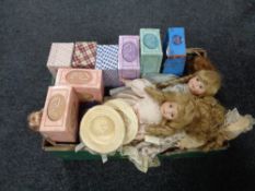 A box containing boxed and unboxed porcelain headed dolls.
