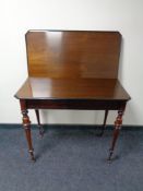 A continental turnover top tea table on turned legs.