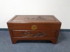 A carved camphor wood blanket box