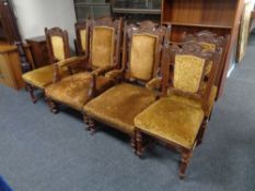 A late 19th century carved oak lady's and gent's armchair upholstered in a gold brocade fabric