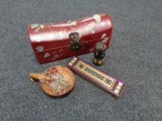 A Chinese style table box containing tourist items