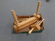 A box containing wooden vices.