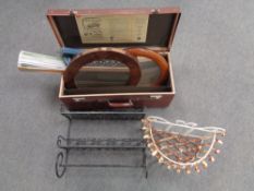 A metal two tier wall shelf together with a metal plant trough and a case containing wall mirror,