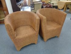 A pair of wicker tub chairs